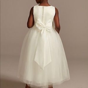 Brand new, never worn ivory flower girl dress and sash (color is petal)